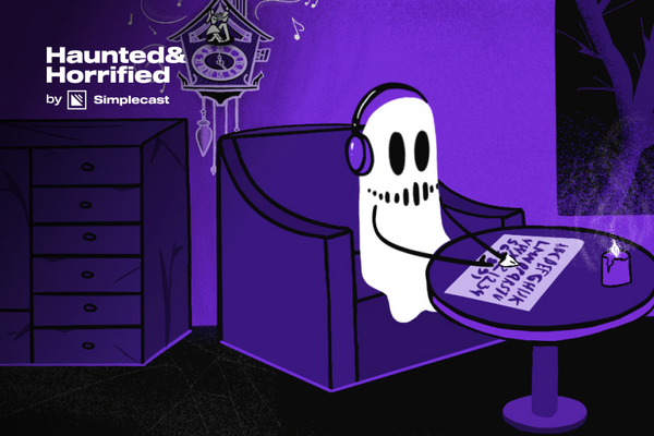 A ghost wearing headphone sits using a ouija board with a lit candle. On the wall is a cuckoo clock.